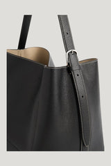 Medium belted grained-leather tote — model side