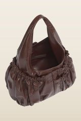 Brown leather gathered hobo bag — model back