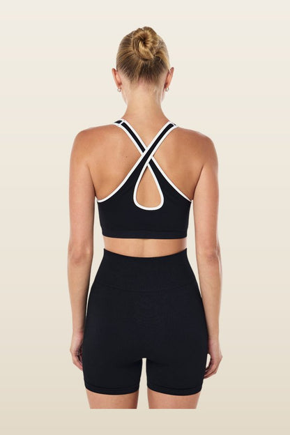 Adaption Seamless Sports Bra In Black & Optic — model back