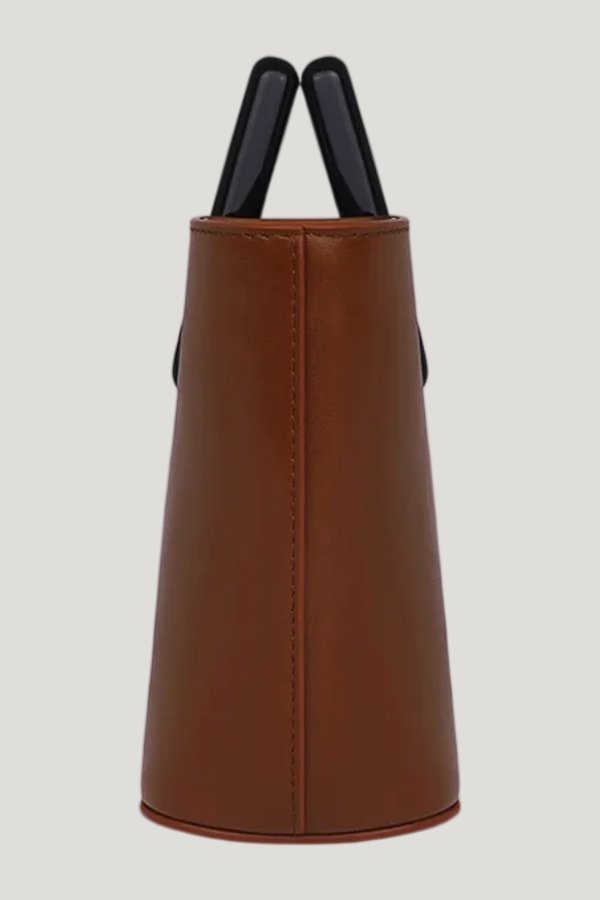 Baby Riviera In Caramel Leather — model side