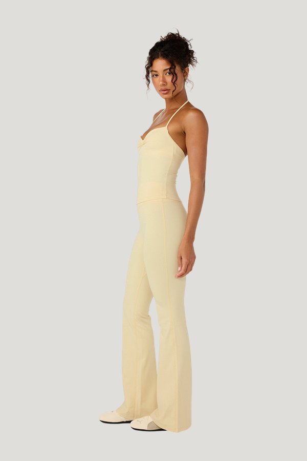 Form Invisible Scrunch Flare Leggings | Butter — model side