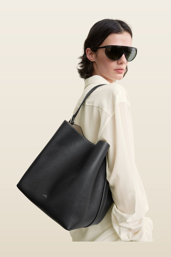 Medium belted grained-leather tote — model back