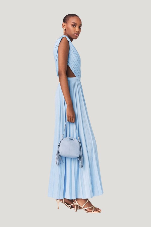 Asymmetrical pleated maxi dress — model side