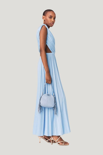 Asymmetrical pleated maxi dress — model side