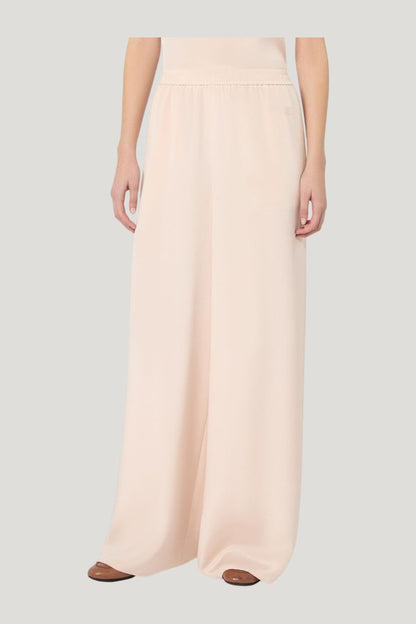 Relaxed-fit heavy silk trousers — model side