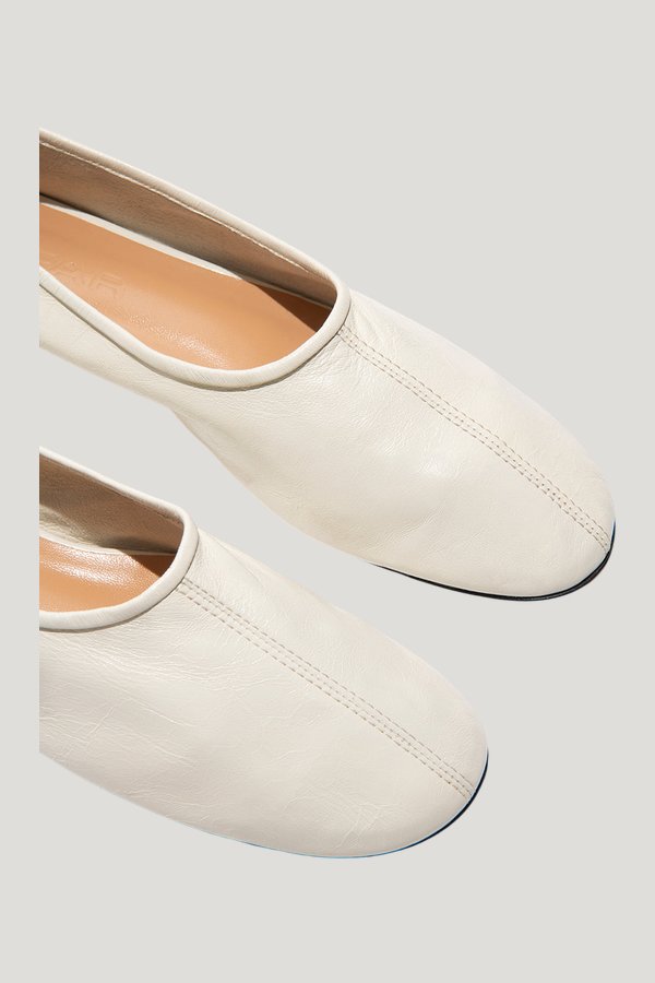 Prudence Limewash Creased Leather Ballet Flat — model side