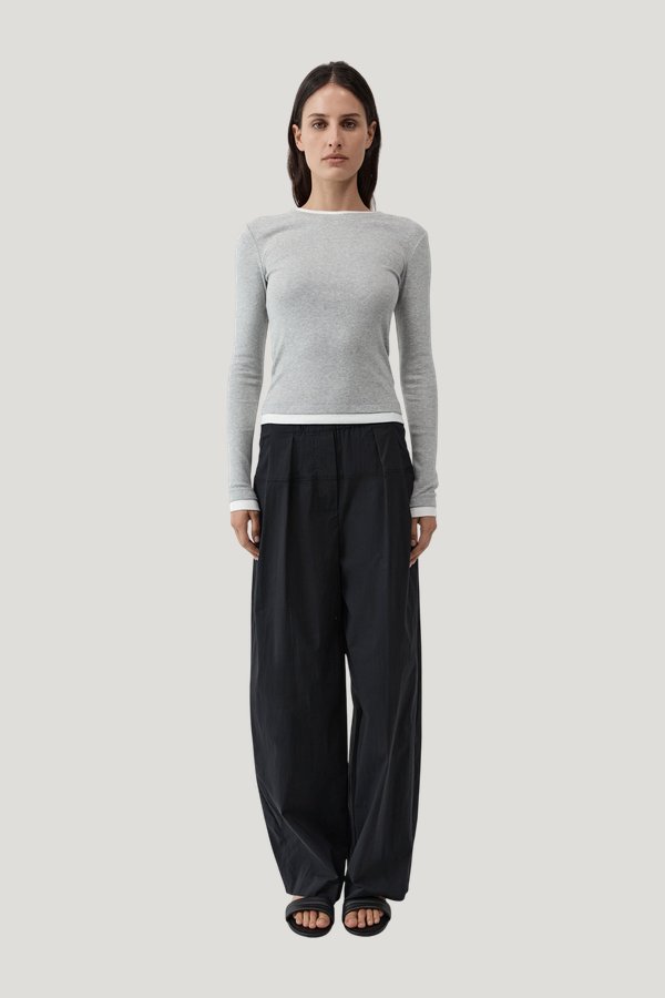 Relaxed Pleat Pants — model front