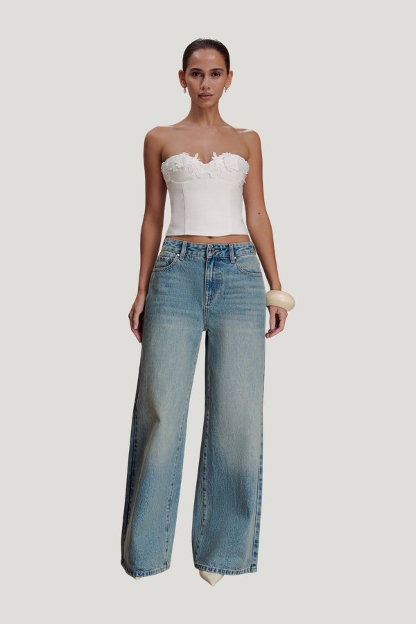 Romi Mid Rise Wide Leg Jeans - Faded Mid — model front