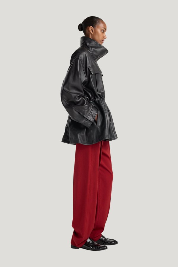 Sculptural leather jacket — model side