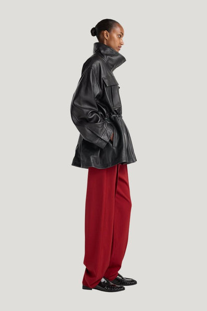 Sculptural leather jacket — model side