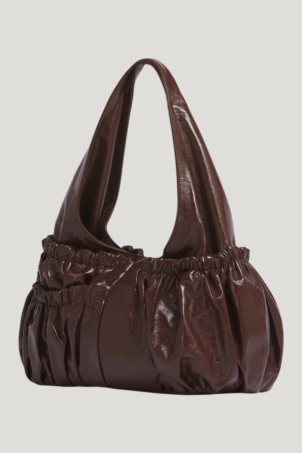 Brown leather gathered hobo bag — model side