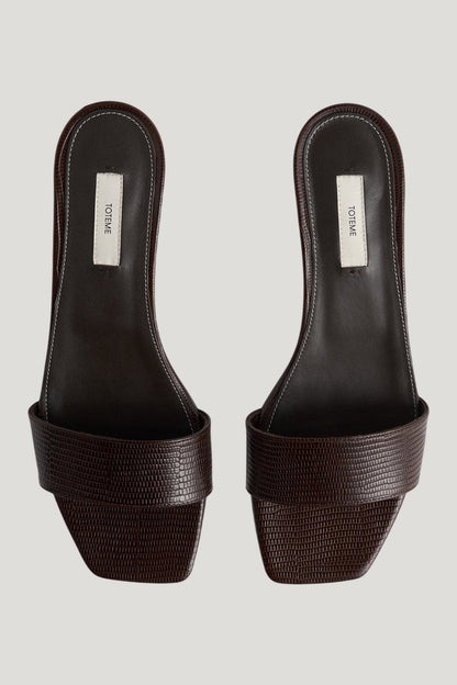 Slim lizard-embossed bandeau mules — model side