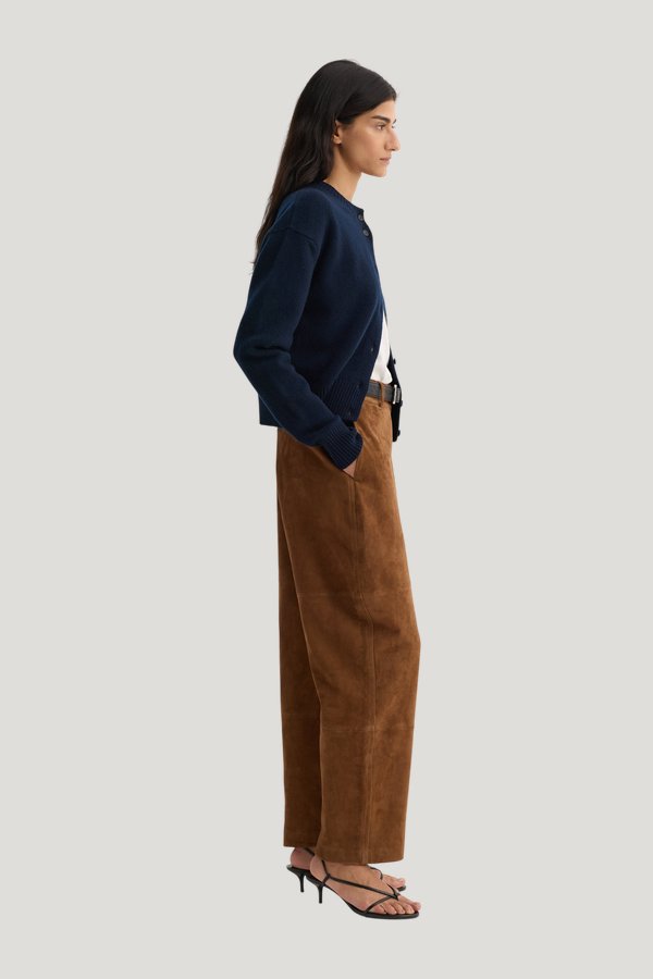 Sculptural suede trousers — model side