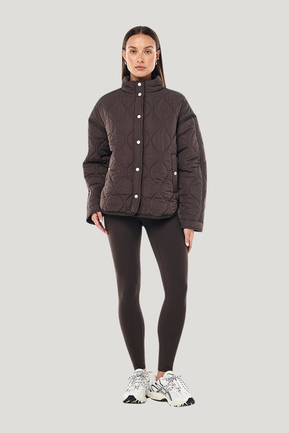 Surge Quilt Jacket In Coffee — model front