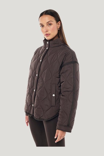 Surge Quilt Jacket In Coffee — model side