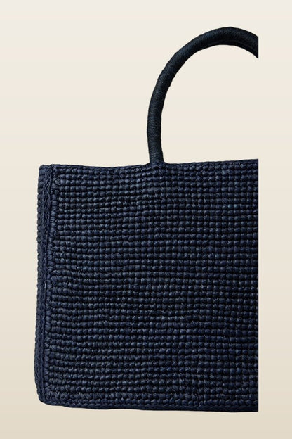 The Charlotte Raffia Bag Small — model back