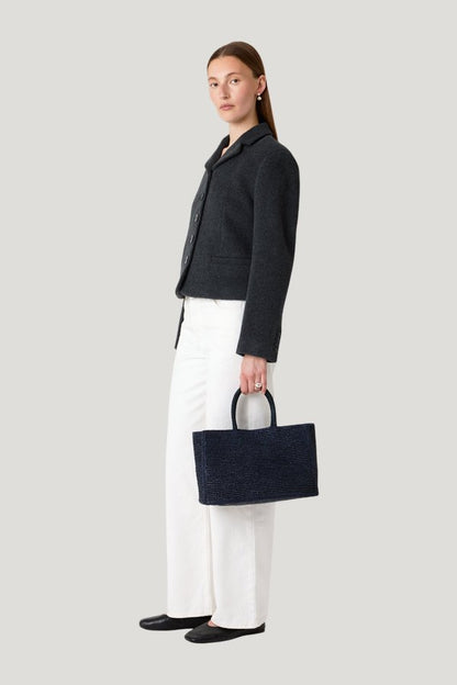 The Charlotte Raffia Bag Small — model side