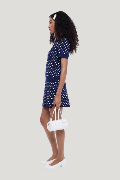 Tumi Sweater Dress In Navy White Polka Dot — model side