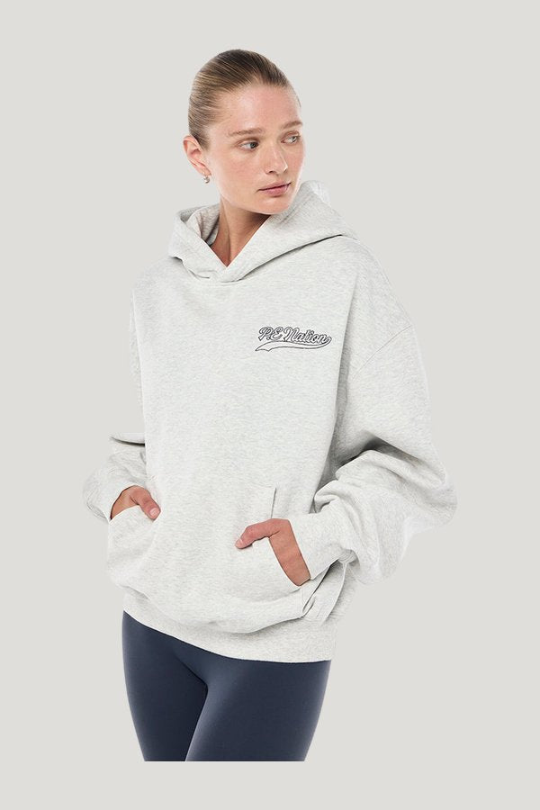 Varsity Oversized Hoodie In Grey Marle — model side